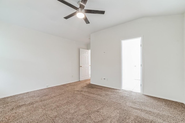 carpeted empty room with vaulted ceiling and ceiling fan