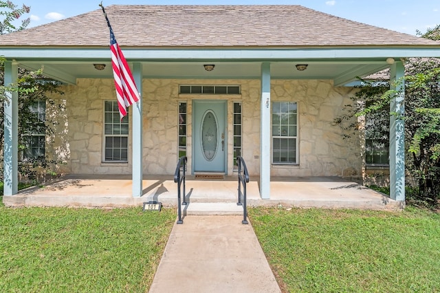 exterior space with a front lawn and covered porch