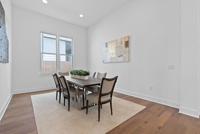 dining area with hardwood / wood-style floors