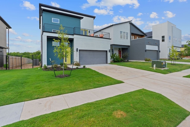 contemporary house with a balcony, a garage, and a front lawn