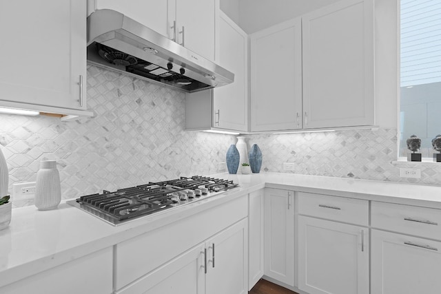 kitchen featuring white cabinets, backsplash, and stainless steel gas stovetop