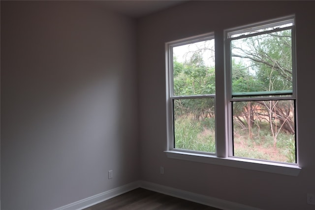 spare room featuring dark hardwood / wood-style flooring