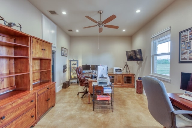 home office with light colored carpet and ceiling fan