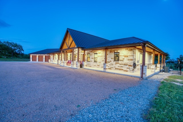 property exterior at dusk featuring a porch