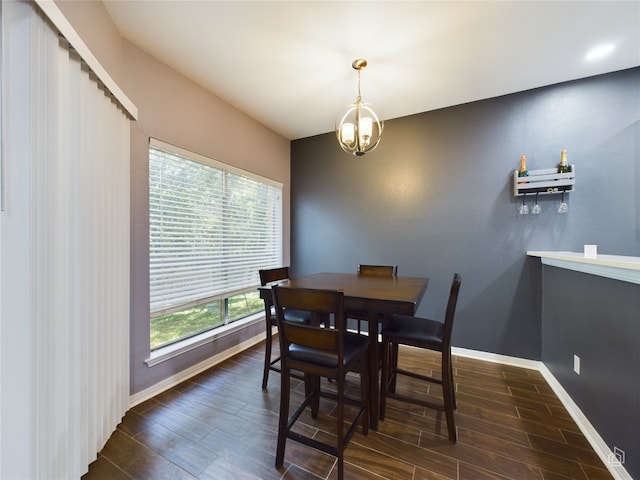 dining area featuring a chandelier and dark hardwood / wood-style floors