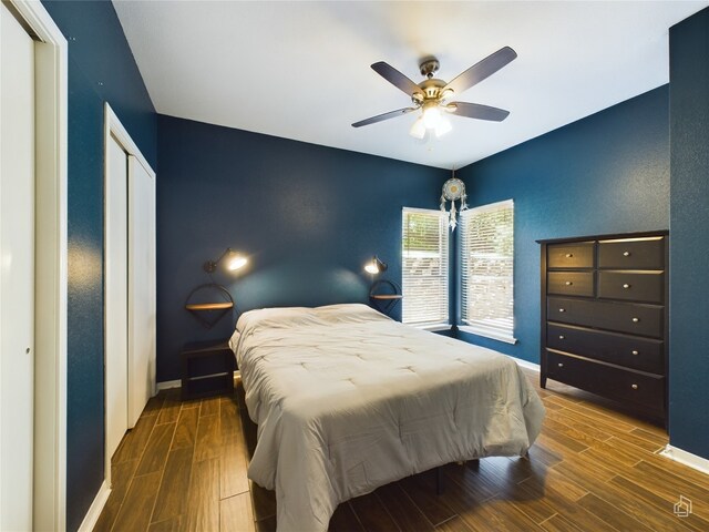 bedroom featuring dark hardwood / wood-style floors and ceiling fan