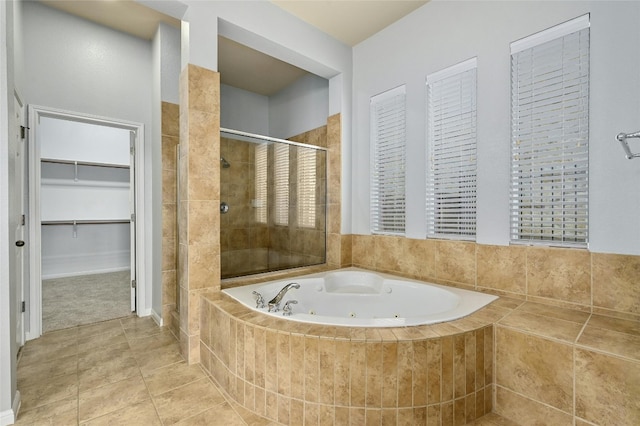 bathroom featuring plus walk in shower and tile patterned flooring