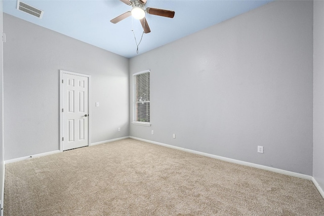 carpeted empty room featuring ceiling fan