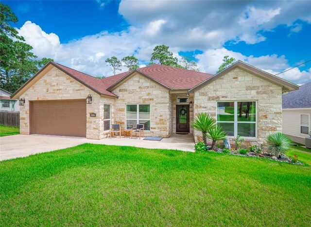 view of front of house with a front lawn and a garage