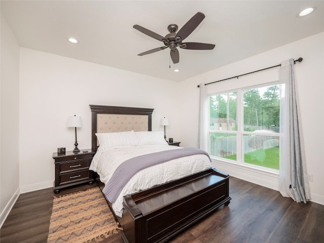 bedroom with ceiling fan and dark hardwood / wood-style flooring