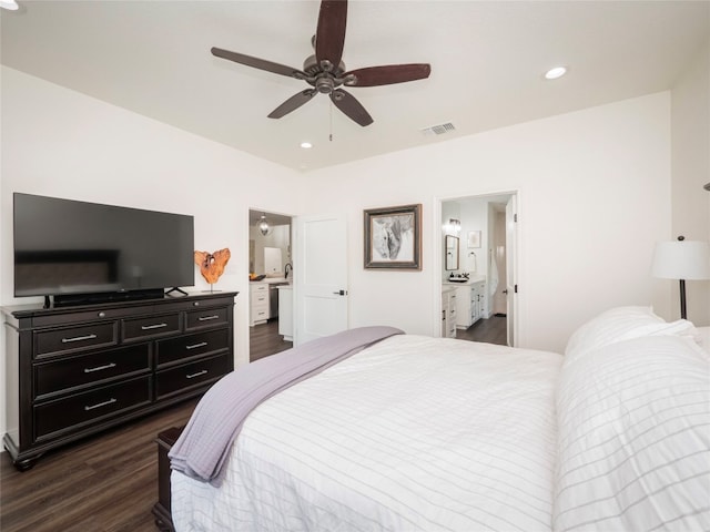 bedroom featuring dark wood-type flooring, connected bathroom, and ceiling fan