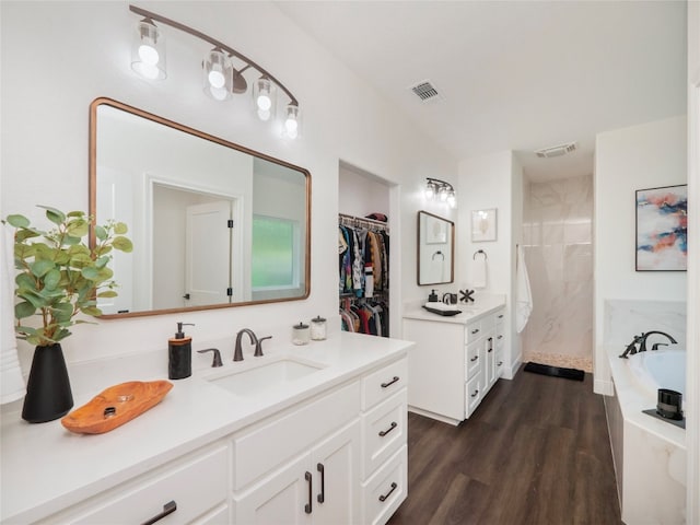 bathroom featuring vanity, wood-type flooring, lofted ceiling, and plus walk in shower