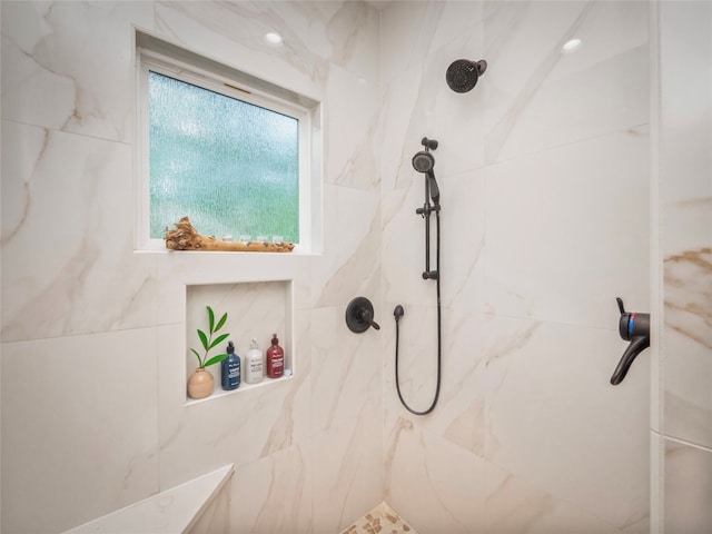 bathroom featuring tiled shower