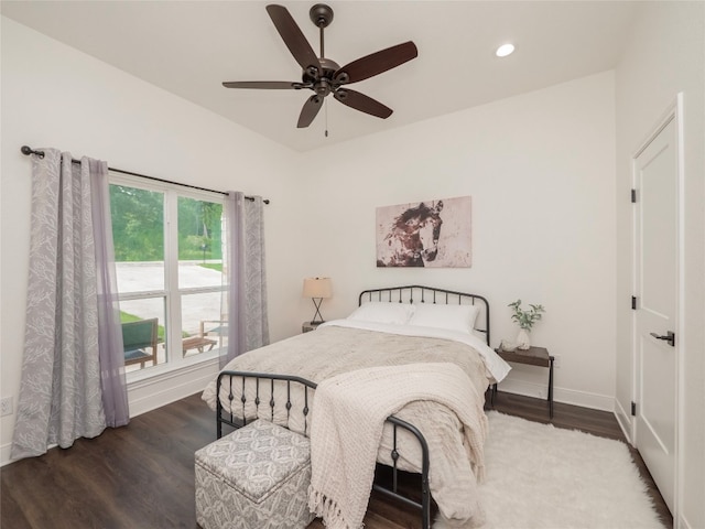 bedroom with ceiling fan and dark hardwood / wood-style floors