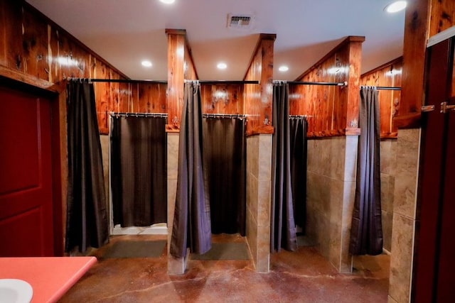 bathroom with wooden walls