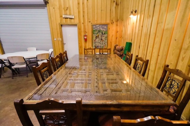 dining space with wooden walls