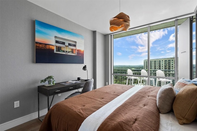 222 W Ave Unit 1404, Austin, TX 78701 - bedroom with wood finished floors and expansive windows