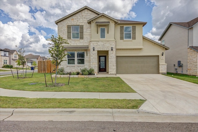 view of front of home with a front lawn and a garage