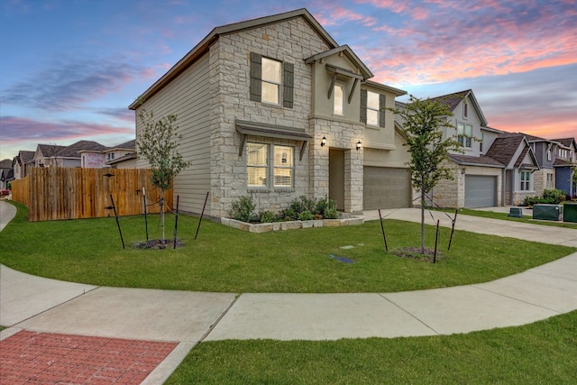 view of front of house with a lawn and a garage