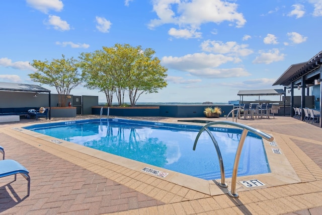 view of swimming pool with a patio