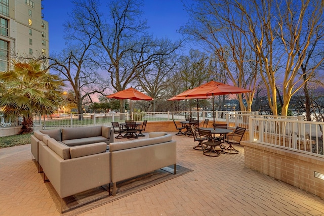 view of patio terrace at dusk