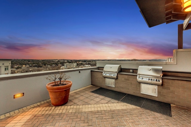 patio terrace at dusk with grilling area and area for grilling