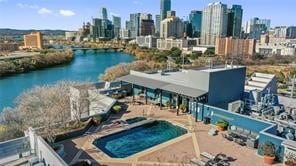 view of pool with a water view