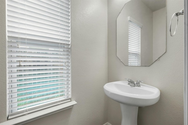 bathroom with a textured wall