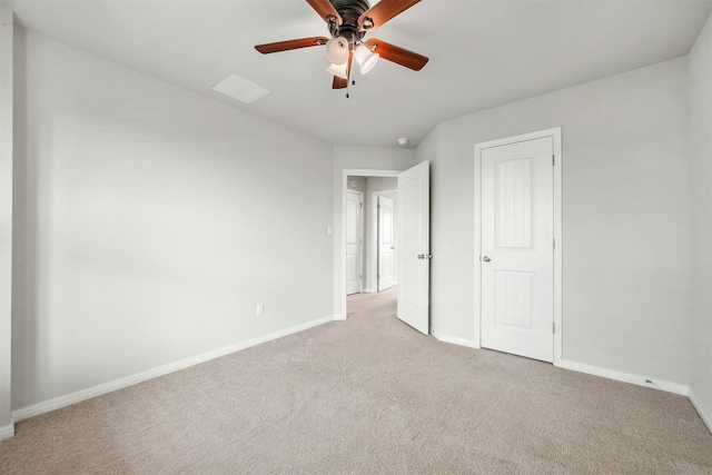 unfurnished bedroom featuring ceiling fan and light carpet