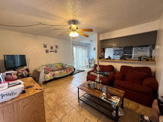 living room with light tile patterned floors, a textured ceiling, and ceiling fan