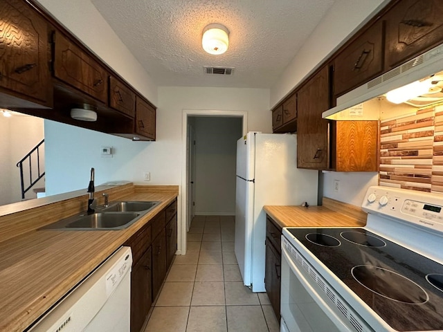 kitchen featuring a textured ceiling, white dishwasher, ventilation hood, range with electric stovetop, and sink