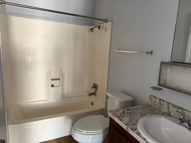 full bathroom featuring vanity, tub / shower combination, and toilet