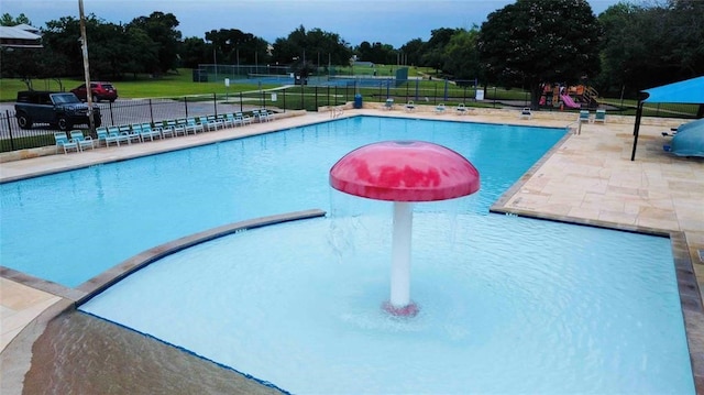 view of pool with a yard