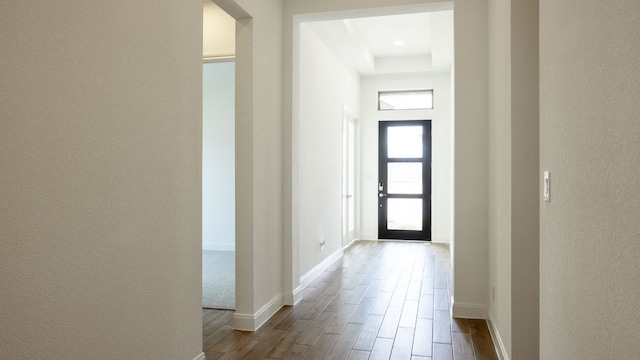 hall with hardwood / wood-style flooring