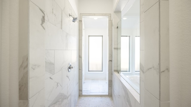 bathroom featuring tile patterned floors and separate shower and tub