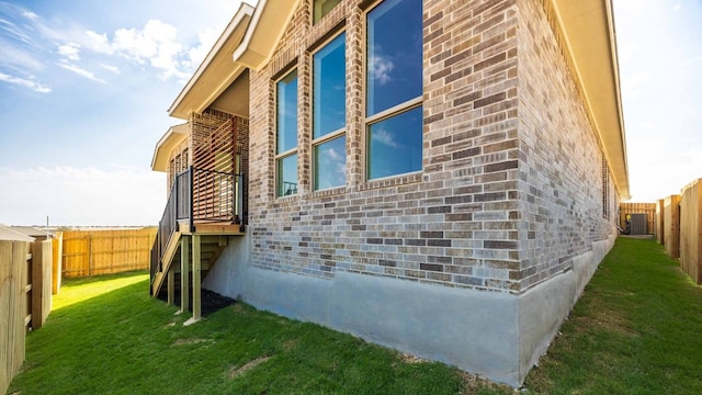 view of side of home featuring a lawn