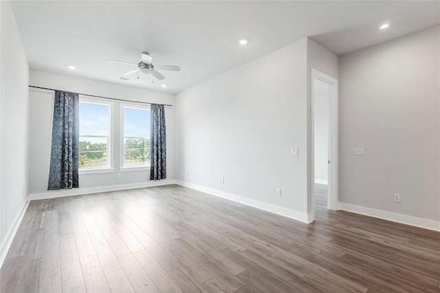 4507 E Martin Luther King Jr Blvd Unit 122, Austin, TX 78721 - spare room with a ceiling fan, dark wood-style floors, baseboards, and recessed lighting