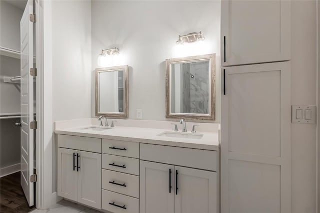 4507 E Martin Luther King Jr Blvd Unit 122, Austin, TX 78721 - bathroom with double vanity and a shower