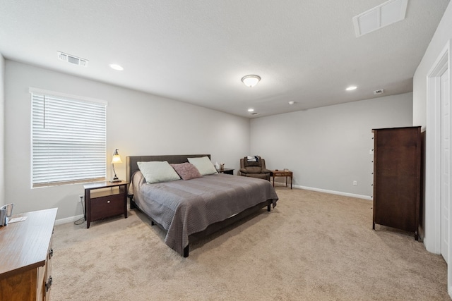 bedroom featuring light colored carpet, visible vents, baseboards, and recessed lighting