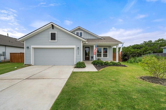 view of front of home featuring board and batten siding, concrete driveway, fence, and a front lawn