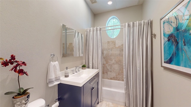full bathroom with shower / tub combo, vanity, and toilet