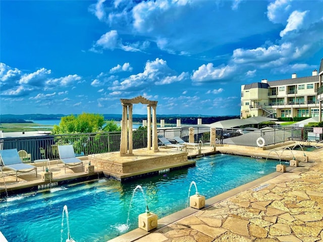view of pool featuring a patio and pool water feature