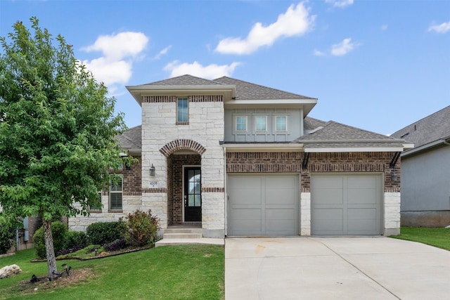 view of front facade with a front yard and a garage