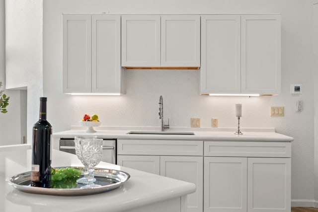 1 Crystal Springs Ct Unit G, The Hills, TX 78738 - kitchen with light countertops and white cabinetry