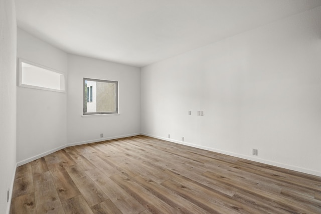 1 Crystal Springs Ct Unit G, The Hills, TX 78738 - empty room with wood finished floors and baseboards