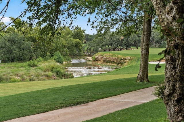 1 Crystal Springs Ct Unit G, The Hills, TX 78738 - view of community with a yard, golf course view, and a water view