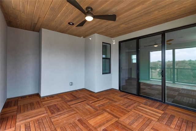 unfurnished room featuring wooden ceiling, parquet flooring, and ceiling fan