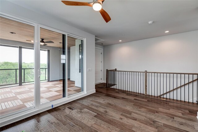 spare room featuring ceiling fan and hardwood / wood-style flooring