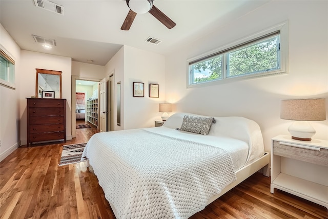 bedroom with wood-type flooring and ceiling fan