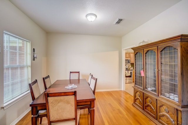 dining room with light wood-type flooring